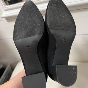 Black short suede ankle boot with heel and golden zipper